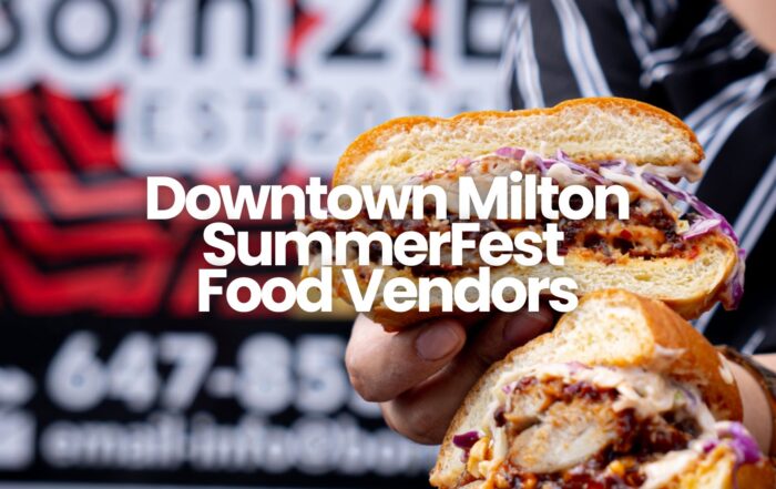 A woman holds a burger cut in half, showing the toppings inside. Text overlay reads, "Downtown Milton SummerFest Food Vendors."
